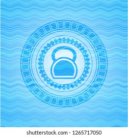kettlebell icon inside sky blue water wave style badge.