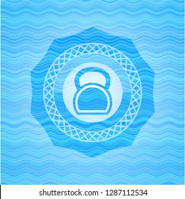 kettlebell icon inside sky blue water emblem.