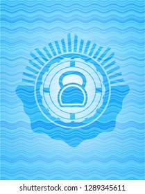kettlebell icon inside sky blue water emblem.