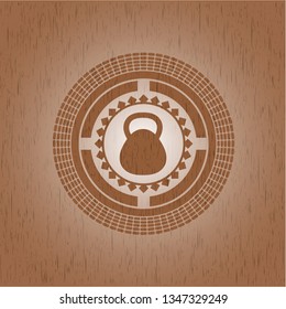 kettlebell icon inside vintage wood emblem