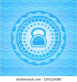kettlebell icon inside water concept style emblem.