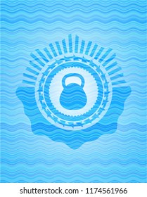 kettlebell icon inside water wave concept badge.