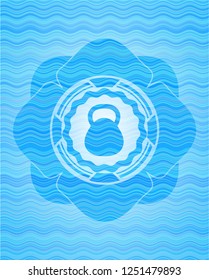 kettlebell icon inside water wave badge.
