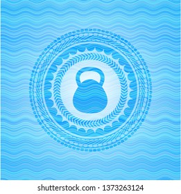 kettlebell icon inside water wave emblem background.