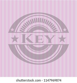 Key badge with pink background