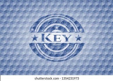 Key blue badge with geometric pattern.
