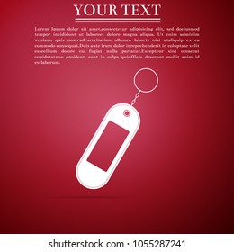 Key chain icon isolated on red background. Blank rectangular keychain with ring and chain for key. Flat design. Vector Illustration