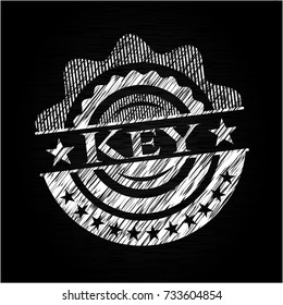 Key chalkboard emblem on black board