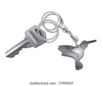 Key with a charm on a white background/Key with a charm in the form of a bird on a white background