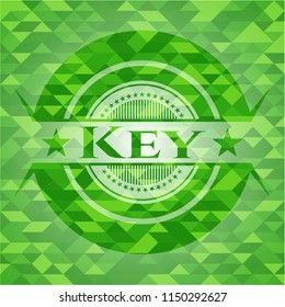 Key green emblem with mosaic background