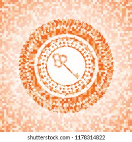 key icon inside abstract emblem, orange mosaic background