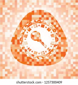 key icon inside abstract orange mosaic emblem