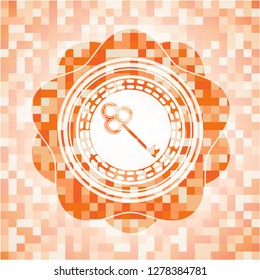 key icon inside abstract orange mosaic emblem