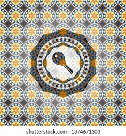 key icon inside arabesque badge background. arabic decoration.