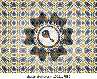key icon inside arabic badge background. Arabesque decoration.