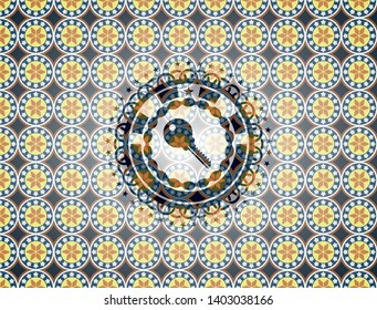 key icon inside arabic badge background. Arabesque decoration.