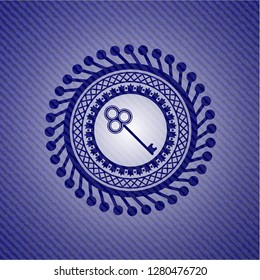 key icon inside badge with denim background