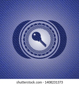 key icon inside badge with denim background