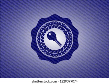 key icon inside badge with jean texture