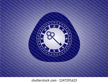 key icon inside badge with jean texture