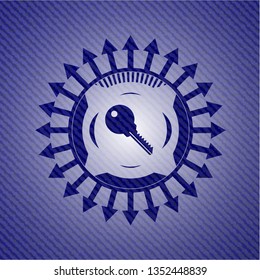 key icon inside badge with jean texture