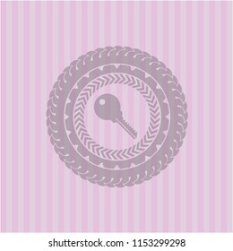 key icon inside badge with pink background