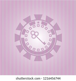 key icon inside badge with pink background