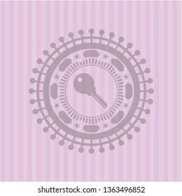 key icon inside badge with pink background