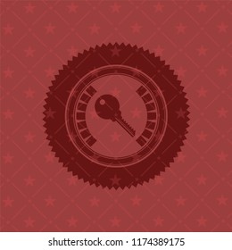 key icon inside badge with red background