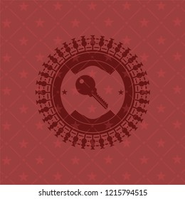 key icon inside badge with red background