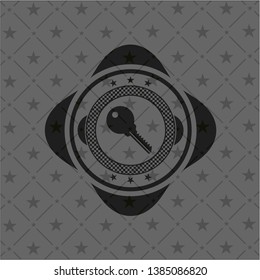 key icon inside black emblem
