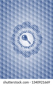 key icon inside blue polygonal emblem.