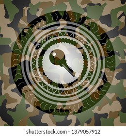 key icon inside camouflage emblem