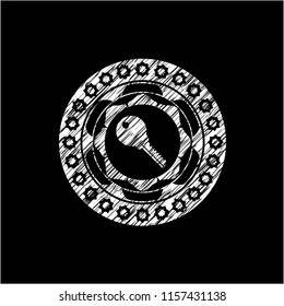key icon inside chalk emblem