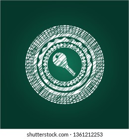 key icon inside chalk emblem