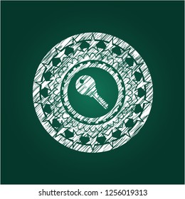 key icon inside chalkboard emblem