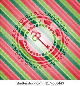 key icon inside christmas badge.
