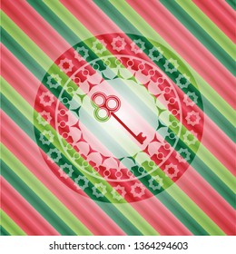 key icon inside christmas badge.