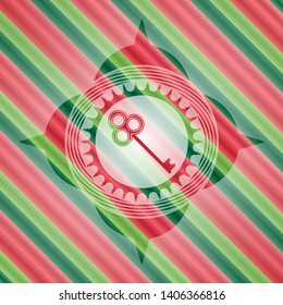 key icon inside christmas badge.