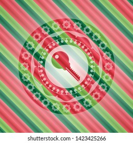 key icon inside christmas badge.