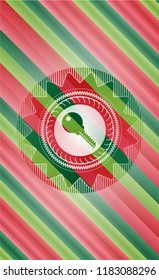 key icon inside christmas colors style emblem.