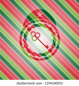 key icon inside christmas colors style badge.