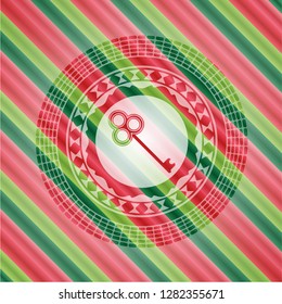 key icon inside christmas colors style badge.