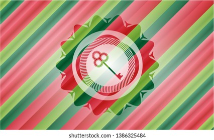 key icon inside christmas colors style emblem.