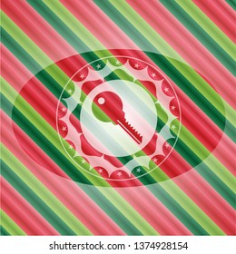 key icon inside christmas emblem.