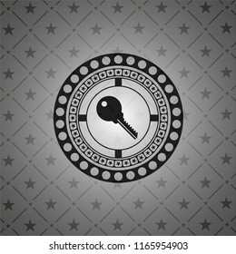 key icon inside dark badge or emblem