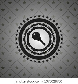 key icon inside dark badge or emblem