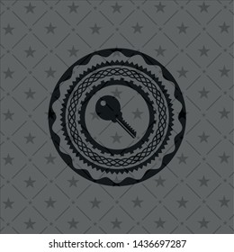 key icon inside dark emblem