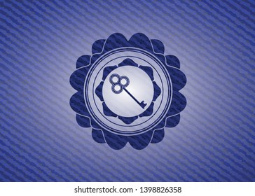 key icon inside emblem with denim high quality background