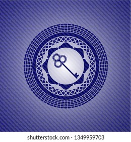 key icon inside emblem with jean background